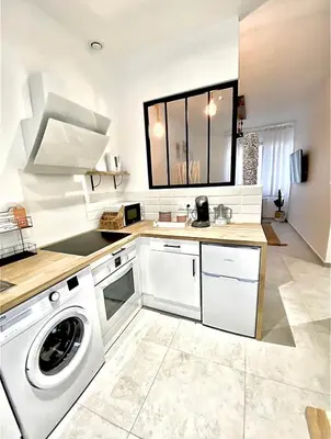 Cuisine ou kitchenette dans l'établissement L’Escale - Le Boho + garage + NETFLIX