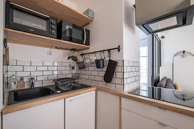 Cuisine ou kitchenette dans l'établissement GuestReady - T1 BIS - Cosy and Lovely