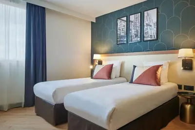 Un ou plusieurs lits dans un hébergement de l'établissement Hotel Gatsby by HappyCulture
