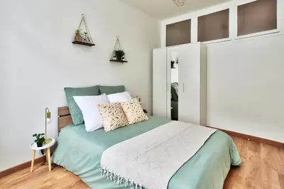 Un ou plusieurs lits dans un hébergement de l'établissement Appartement Cosy du Gier