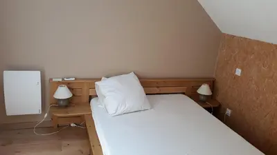 Un ou plusieurs lits dans un hébergement de l'établissement Agréable gîte en pleine nature