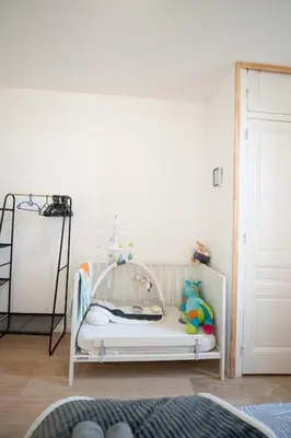 Un ou plusieurs lits dans un hébergement de l'établissement Aux portes de Lyon Tout confort emplacement idéale Netflix