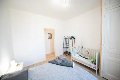 Un ou plusieurs lits dans un hébergement de l'établissement Aux portes de Lyon Tout confort emplacement idéale Netflix
