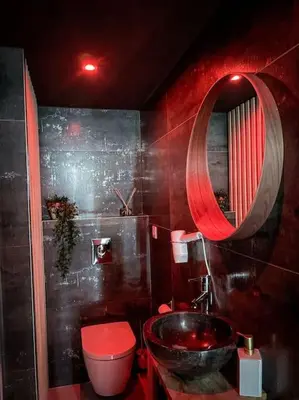 Salle de bains dans l'établissement Suite Luxueuse Jacuzzi SUITE AMANTIS By Noma