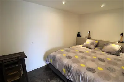 Un ou plusieurs lits dans un hébergement de l'établissement Gîte Sous le Marronnier aux portes de Lyon