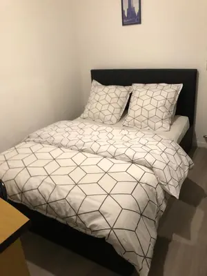 Un ou plusieurs lits dans un hébergement de l'établissement Chambre Simple privée Saint Priest