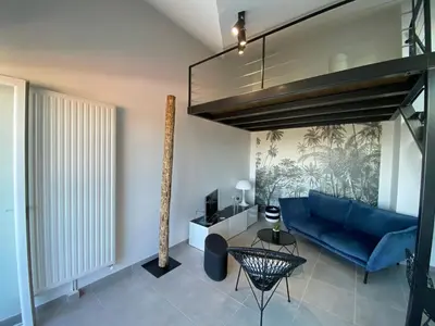 Coin salon dans l'établissement Appart & Fleurinoise balcon ascenseur climatisation