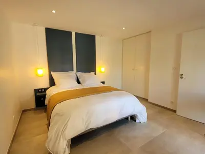 Un ou plusieurs lits dans un hébergement de l'établissement LODGES EN PIERRES DOREES