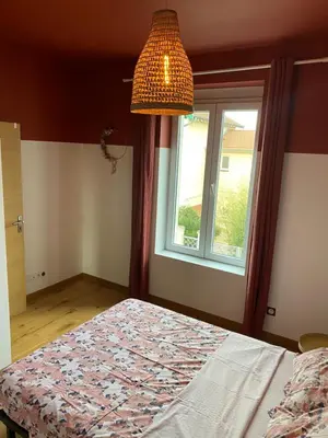 Un ou plusieurs lits dans un hébergement de l'établissement Maison lyon 8 jardin parking studio indépendant sur demande
