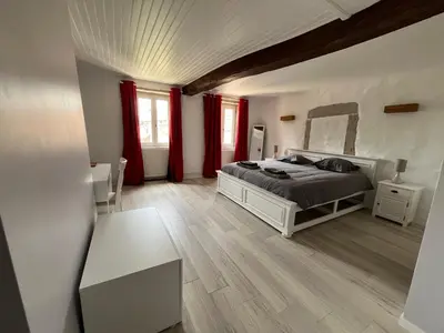 Un ou plusieurs lits dans un hébergement de l'établissement Au Clair de la Pierre - Chambres d'hôtes