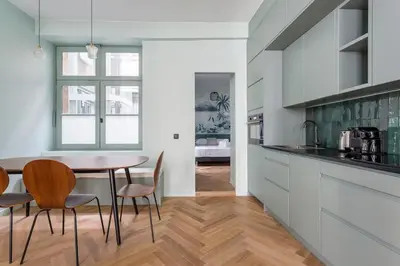 Cuisine ou kitchenette dans l'établissement HAMAC Suites Suite St Antoine 2 CH Unique