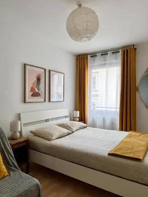 Un ou plusieurs lits dans un hébergement de l'établissement Nice Apartment with Parking balcon Casa Lyon
