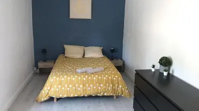 Un ou plusieurs lits dans un hébergement de l'établissement Bald'Home côté jardin