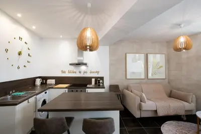 Coin salon dans l'établissement La Suite Sépia - Superbe appartement Vieux Lyon