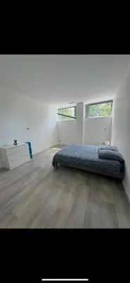 Un ou plusieurs lits dans un hébergement de l'établissement Loft épuré avec parking privé.