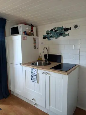 Cuisine ou kitchenette dans l'établissement Roulotte Authentique 'Le Temps d une Pause