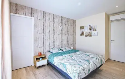 Un ou plusieurs lits dans un hébergement de l'établissement Cozy Home In Pont-Évêque