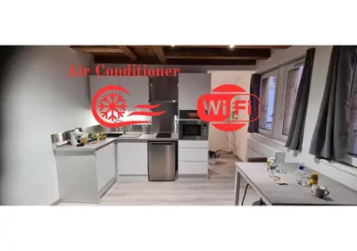 Cuisine ou kitchenette dans l'établissement STUDIO CLIMATISATION Vieille Ville