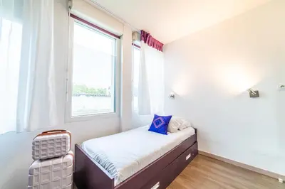 Un ou plusieurs lits dans un hébergement de l'établissement Montempô Appart'hôtel Lyon Viviani