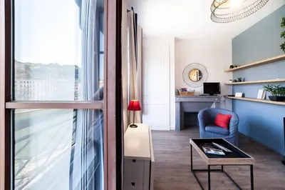 Coin salon dans l'établissement AllinLyon | Charme & vue sur Saône