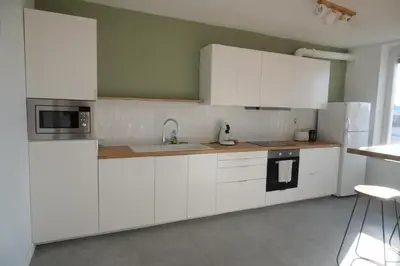 Cuisine ou kitchenette dans l'établissement Grand appartement 80m² - Suite parentale