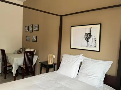 Un ou plusieurs lits dans un hébergement de l'établissement Chambre Univers Bocuse - à 200 m de la Légende