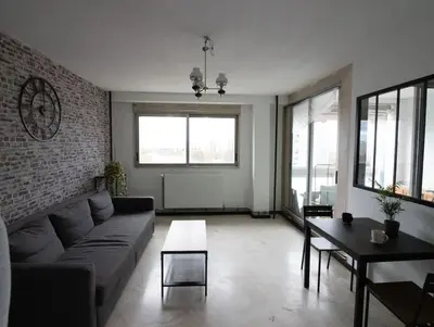 Coin salon dans l'établissement Logement entier proche de Lyon