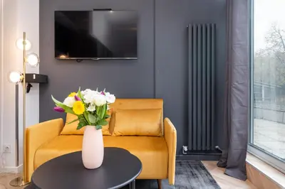 Télévision ou salle de divertissement dans l'établissement Les Cocons Heritages