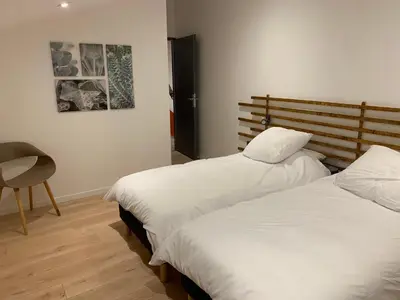Un ou plusieurs lits dans un hébergement de l'établissement Gîte chez GAREL 15 personnes avec spa