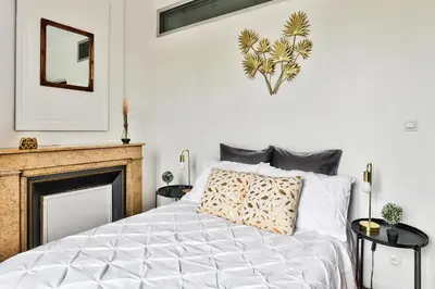 Un ou plusieurs lits dans un hébergement de l'établissement Appartement Le Cocon Lyonnais