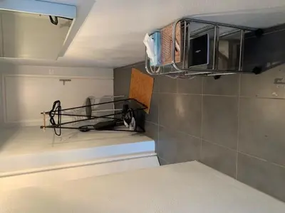 Cuisine ou kitchenette dans l'établissement chambre indépendante chez particuliers avec salle de bain privative