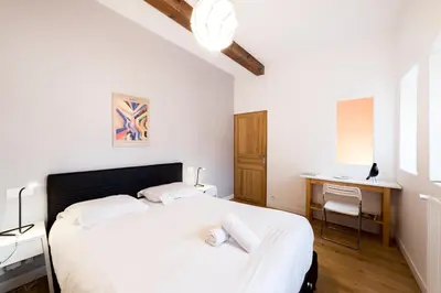 Un ou plusieurs lits dans un hébergement de l'établissement All in Lyon | Grand duplex avec vue sur Fourvière