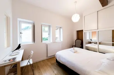 Un ou plusieurs lits dans un hébergement de l'établissement All in Lyon | Grand duplex avec vue sur Fourvière