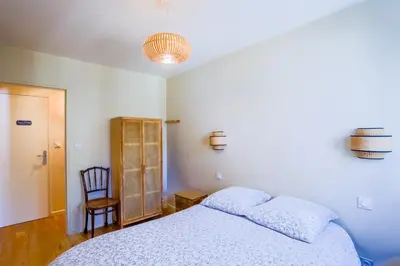 Un ou plusieurs lits dans un hébergement de l'établissement Lyon Premium - LuxeZen SPA