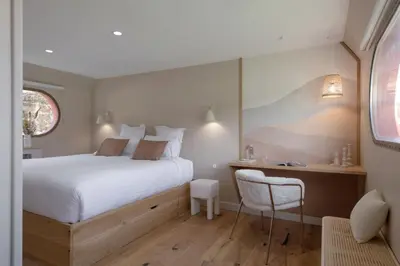 Un ou plusieurs lits dans un hébergement de l'établissement LA PENICHE - Bed And Bicycle - Vienne