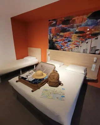 Un ou plusieurs lits dans un hébergement de l'établissement KYRIAD DIRECT LYON NORD - Dardilly