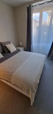 Un ou plusieurs lits dans un hébergement de l'établissement Beau Appartement T2