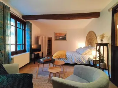 Un ou plusieurs lits dans un hébergement de l'établissement Studio cosy Chez Ré