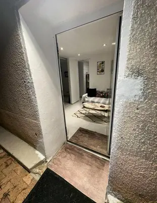 Un ou plusieurs lits dans un hébergement de l'établissement Joli appartement au calme avec place de parking privé