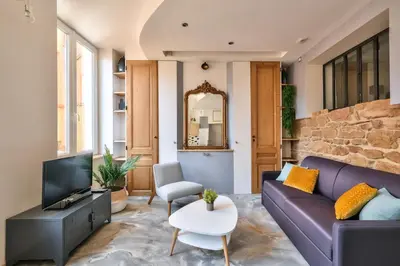 Coin salon dans l'établissement Appartement Le Cosy - Calme & Chaleureux - Bien situé