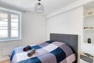 Un ou plusieurs lits dans un hébergement de l'établissement L'Escale charmante & cosy - T2 - Montluel